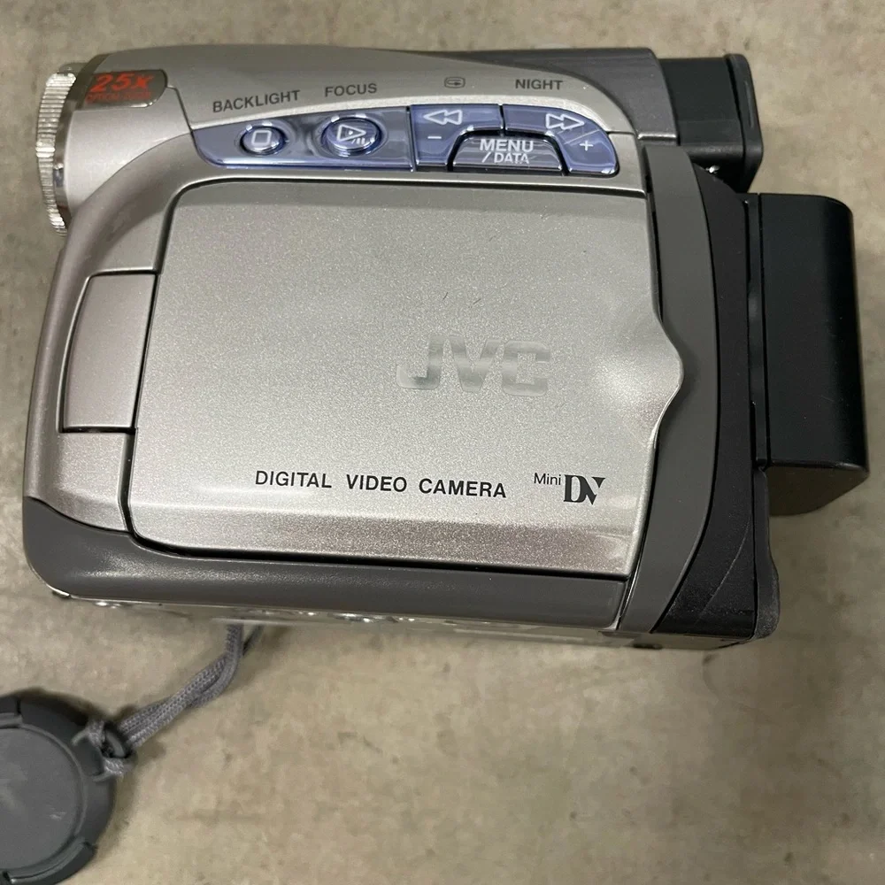 JVC Silver Digital Video Camera with accessories.